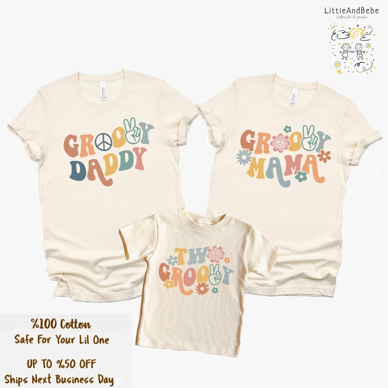 May include: Three t-shirts with a groovy theme. The shirts are beige with colorful text and peace signs. The text on the shirts reads "Groovy Daddy", "Groovy Mama", and "Two Groovy".