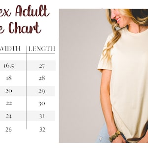 May include: Cream-colored unisex t-shirt with rolled sleeves. The image includes a size chart with measurements in inches for XS to 2XL sizes. The chart shows width and length dimensions for each size. The shirt is worn by a person.