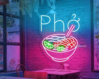May include: Neon sign with the word "Pho" in white and a bowl of pho with noodles, meat, lime, and herbs in green and pink.