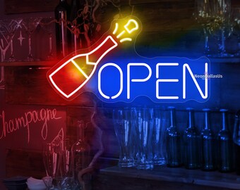 May include: A neon sign with a blue "OPEN" sign and a red and yellow champagne bottle popping. The sign is hanging above a bar with shelves of glasses and bottles.