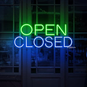 May include: A neon sign with the words "OPEN CLOSED" in green and blue neon lights. The sign is mounted on a glass door.