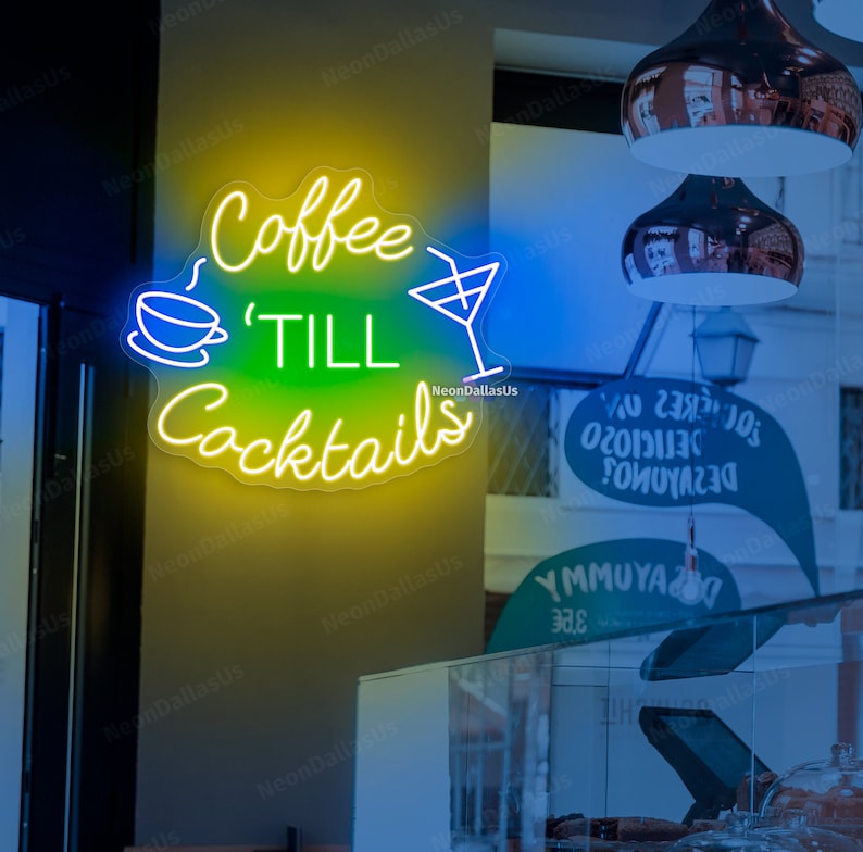 May include: Neon sign with yellow and green text that reads "Coffee 'Till Cocktails" with a white coffee cup and martini glass graphic.
