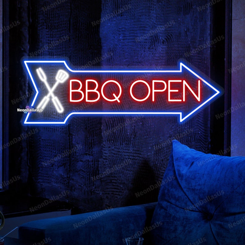 May include: A neon sign with a blue arrow pointing to the right. The sign says "BBQ OPEN" in red neon letters. There are white neon images of a spatula and tongs crossed over each other.