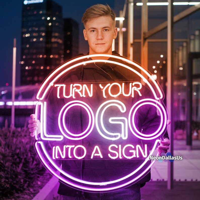 May include: A person holding a neon sign that says "Turn Your Logo Into A Sign". The sign is pink and purple and has a circular shape.