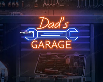 Peut inclure: Un panneau lumineux au néon avec le texte "Dad's Garage" en orange et bleu. Le panneau représente une clé à molette avec une poignée bleue et des lignes orange.
