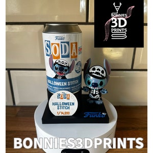 May include: A blue and white Funko Soda figure of Stitch dressed as a skeleton for Halloween. The figure is on a black base with a white turntable. The figure is 1/14,200 scale.