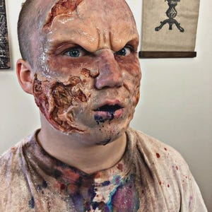 Realistic 4-piece silicone burn prosthetic – Syncap encapsulated, flexible & skin-soft. Single-use only.