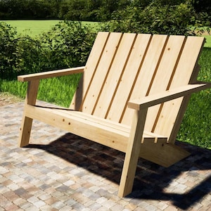 Può includere: Una panca in legno con schienale a doghe e braccioli, realizzata in legno naturale con finitura marrone chiaro. La panca è posizionata su un patio in mattoni.