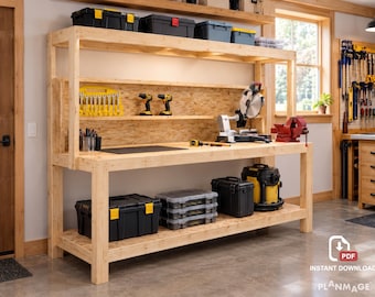 May include: A large wooden workbench featuring a multi-level design with a spacious top surface, a middle shelf for tools, and a bottom shelf for storage. The unit includes a miter saw, a red bench vise, and various black and yellow tool cases.