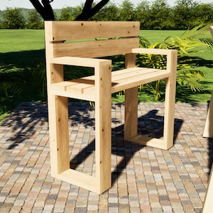 May include: A wooden bench with a back and armrests, made of natural wood with a light brown finish. The bench is sitting on a brick patio.