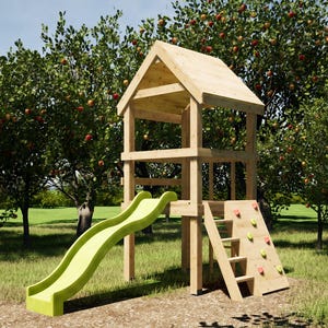 May include: A wooden playset with a green slide, climbing wall, and ladder. The playset is in a grassy area with trees in the background. The playset has a small house-like structure on top. The slide is approximately 6 feet long.