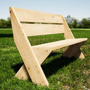 May include: A light-coloured wooden bench with a slatted back and angled legs. The bench is set on a grassy lawn, with trees and a mountain visible in the background. The bench is approximately 122 cm long.