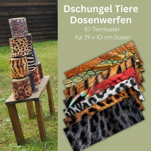 May include: A set of 10 colorful cans with animal print designs for a jungle-themed game of can toss. The cans are 29 x 10 cm and are stacked on a wooden table in a backyard setting. The text on the image reads "Dschungel Tiere Dosenwerfen 10 Tiermuster für 29 x 10 cm Dosen".