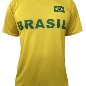 May include: A yellow t-shirt with a green "BRASIL" text and a small green, blue, and yellow flag on the right side.