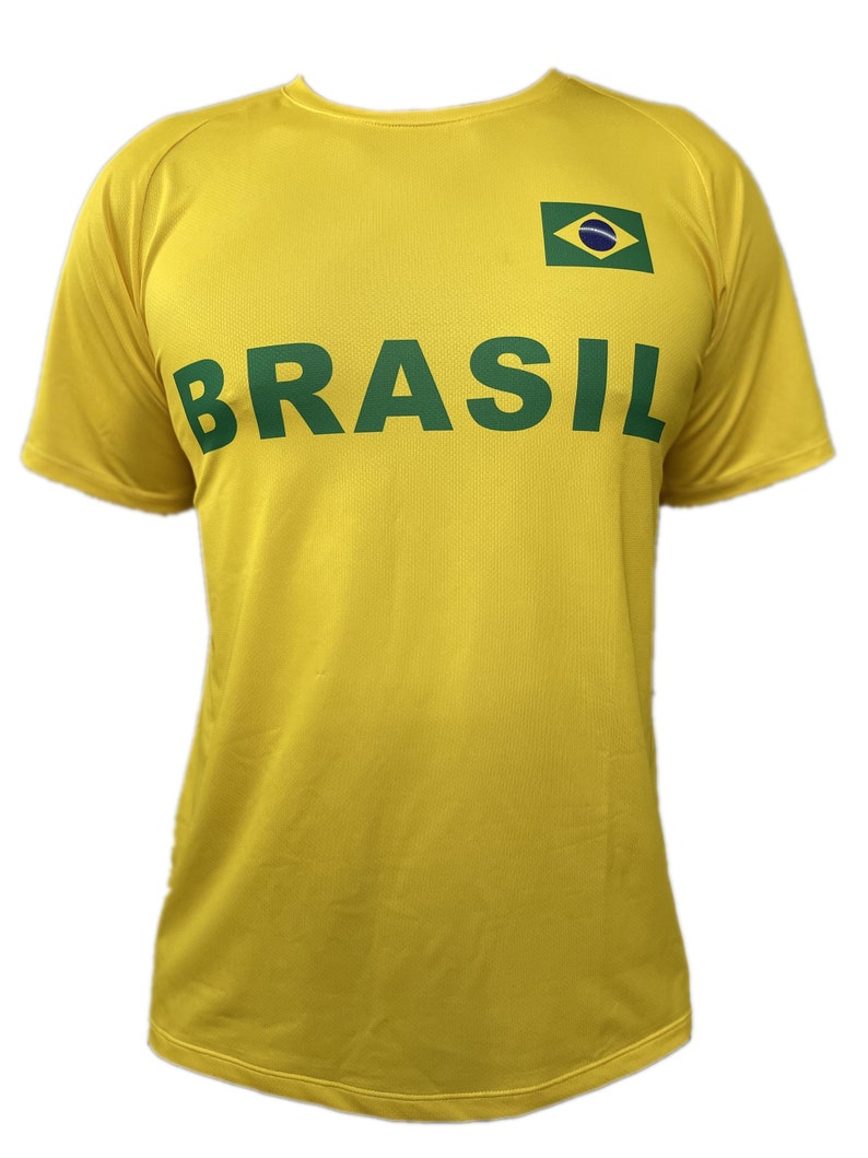 May include: A yellow t-shirt with a green "BRASIL" text and a small green, blue, and yellow flag on the right side.
