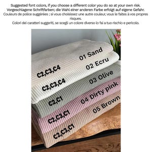 May include: A selection of knitted blankets in shades of sand, ecru, olive, dirty pink, and brown, each labelled with a number and colour name. The text "Suggested font colours..." is at the top.