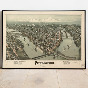 May include: An antique map of Pittsburgh, Pennsylvania from 1884. The map shows the city's layout with rivers, bridges, and buildings in a detailed illustration.