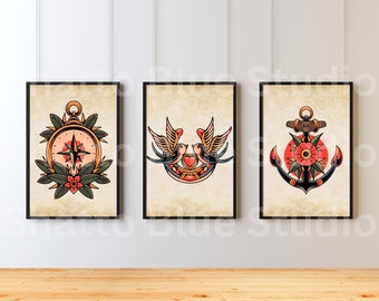 May include: Three vintage-style nautical themed prints in black frames. The prints feature a compass, a pair of swallows with a heart, and an anchor with a red flower.