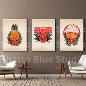 May include: Three vintage-style illustrations in frames, each depicting a different fruit or food item. The first shows a pineapple with green leaves and a red flower. The second shows a slice of watermelon with green leaves and a red flower. The third shows a cupcake with white frosting and sprinkles, green leaves, and a red flower.