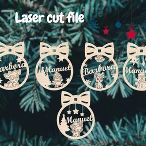 May include: Laser cut wooden Christmas ornaments with bow details. Each ornament features a name and a festive design, including a reindeer, snowman, and Christmas tree. The text "Laser cut file" is at the top.