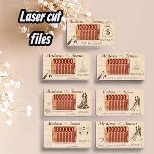 May include: Laser-cut wooden plaques with the names "Madara & Tomas" and the number "1000000" printed on them. The plaques feature various designs, including a money bag, a couple, and celebratory graphics. The text "Laser cut files" is also present.