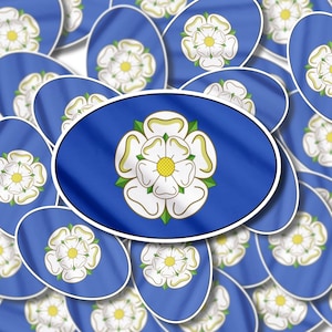 May include: A close-up of a pattern of white roses on a blue background. The roses are stylised and have a green stem and leaves. The pattern is repeated on many oval-shaped stickers.
