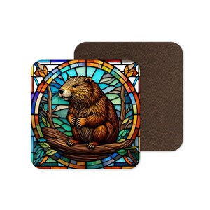 May include: A stained glass style coaster featuring a brown beaver sitting on a branch. The background is a colourful mosaic of blues, greens, yellows, and oranges.