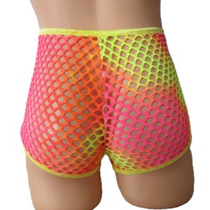 May include: Neon pink, orange, and yellow fishnet shorts. The shorts have a gradient effect, transitioning from pink to orange and then to yellow. The edges are trimmed with yellow fabric.