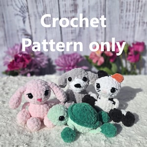 May include: A selection of crocheted amigurumi animals: a pink bunny, a grey dog, a green turtle, and a black and white cat. The text "Crochet Pattern only" is displayed in white. The toys are on a white, fluffy surface.