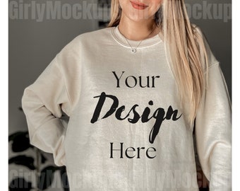 May include: A beige sweatshirt with the text "Your Design Here" printed on the front.