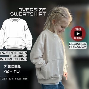 May include: An oversized beige sweatshirt with a front pocket is modeled by a young person. The image includes a line drawing of the sweatshirt, text that reads "PDF Pattern + Sewing Instructions", and "Beginner Friendly". The sweatshirt pattern is available in 7 sizes.