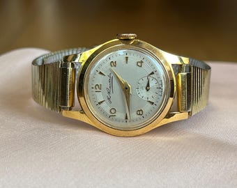 DOXA 手巻き腕時計 スイス製 ビンテージ シルバー ラウンドフェイス ヴィンテージ DOXA スイス製自動巻き腕時計、ラウンド型シルバー文字盤