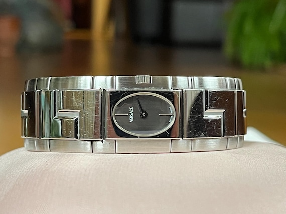 Elegant 1990s Vintage quartz Swiss ladies dress watch Versace silver tone stainless steel case solid bracelet, Women rigid bangle watch Elegant 1990s Vintage quartz Swiss ladies dress watch Versace silver tone stainless steel case solid bracelet, Women rigid bangle watch