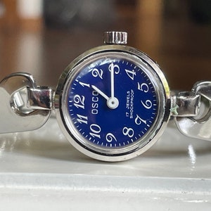 Elegante reloj de pulsera vintage alemán de 1960 con 17 joyas para mujer, caja color plata Osco con brazalete de metal, reloj de cóctel retro alemán.