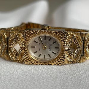 Splendido orologio da polso da donna vintage svizzero del 1960, modello Avia, cassa color oro con bracciale in acciaio inossidabile, orologio elegante, regalo orologio da donna