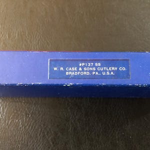 May include: A blue box with the text "#P137 SS" and "W. R. CASE & SONS CUTLERY CO. BRADFORD. PA., U.S.A." printed on it. The box is likely for a cutlery product.