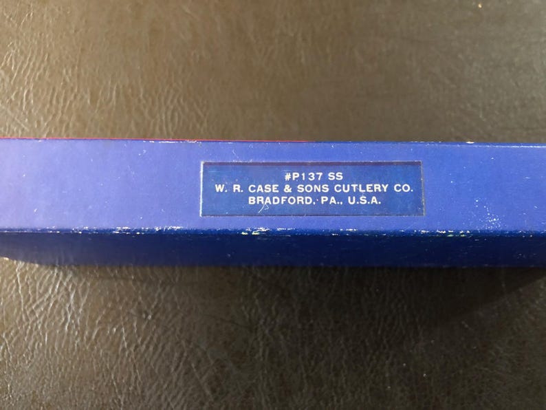 May include: A blue box with the text "#P137 SS" and "W. R. CASE & SONS CUTLERY CO. BRADFORD. PA., U.S.A." printed on it. The box is likely for a cutlery product.