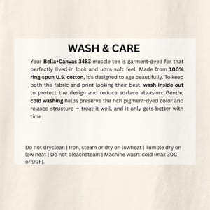 May include: A white card with the text "WASH & CARE" in black. The card provides washing instructions for a Bella+Canvas 3483 muscle tee, including washing inside out, cold washing, and low heat drying.