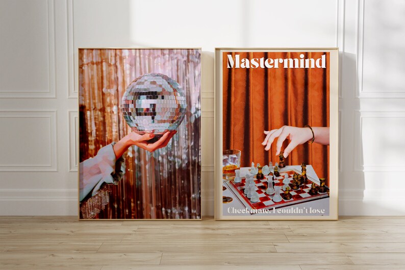 May include: Two framed posters with a retro aesthetic. The left poster features a hand holding a disco ball against a shimmering background. The right poster features a hand reaching for a chess piece on a chessboard with the text "Mastermind" and "Checkmate. I couldn't lose."