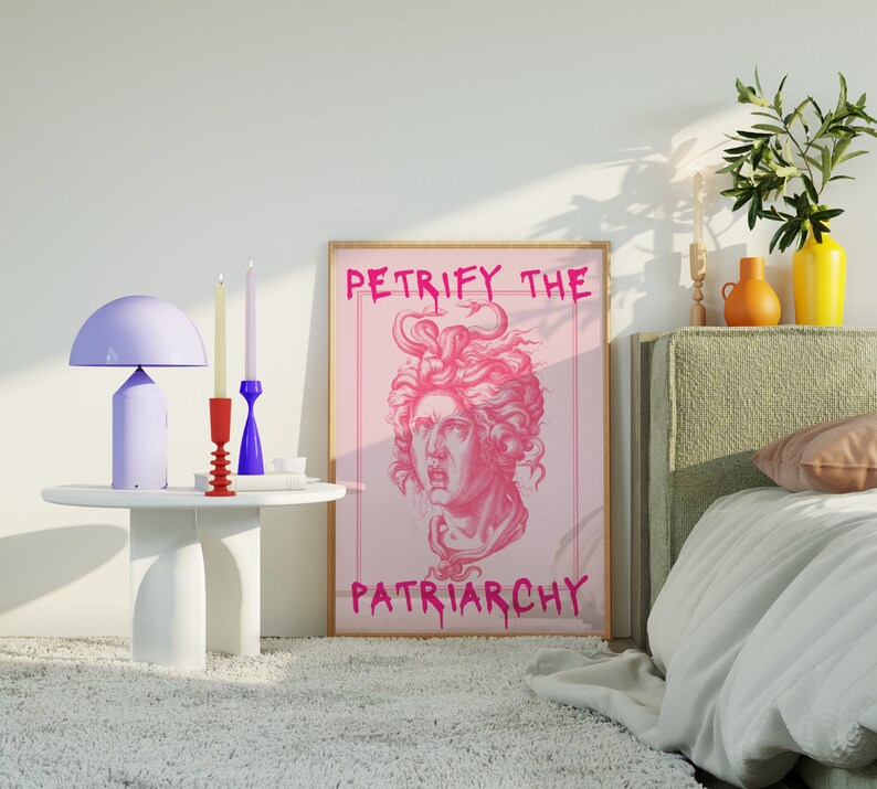 May include: A pink and white poster with the text "Petrify the Patriarchy" and a pink illustration of a woman's head with snakes in her hair.
