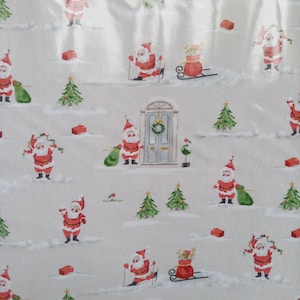 May include: Wrapping paper featuring a repeating pattern of Santa Claus figures in red suits, green gift sacks, decorated Christmas trees, red gift boxes, and a light blue front door with a wreath on a light gray background with white snow accents.