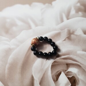 Decorative Bead and Gold Tone Ring