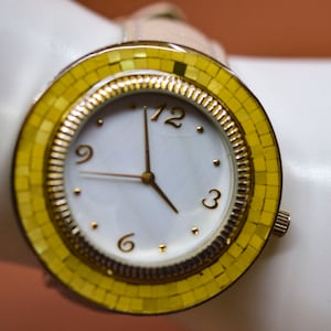 Chico&#39;s white tone with yellow ornament, womens large , quartz wrist watch