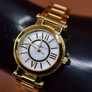 Isaak Misrahi Live, gold tone with mop dial, womens fashion watch