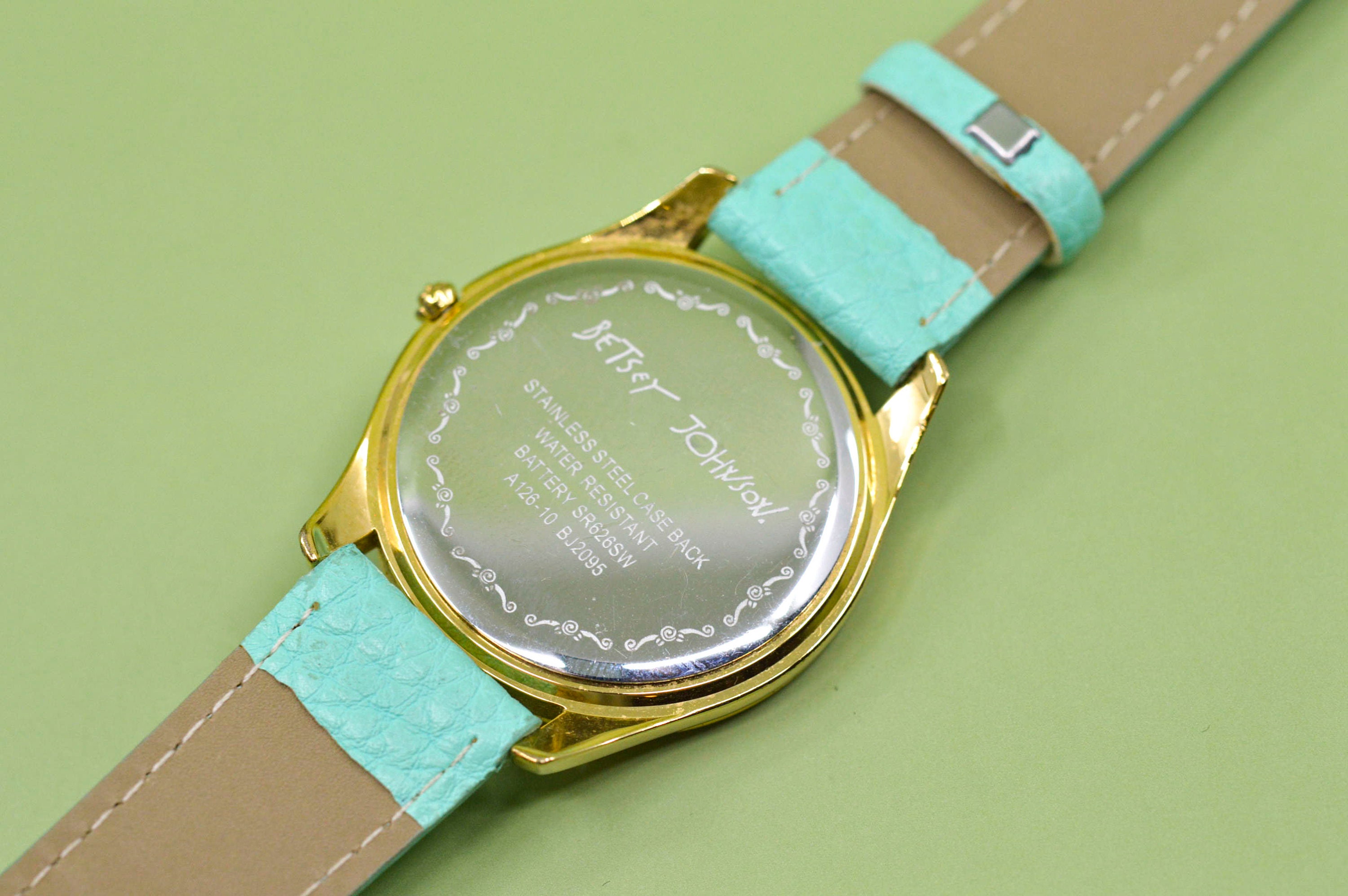 Betsy Johnson , Gold Tone With White Dial ,blue Bracelet 