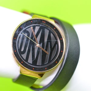 DKNY gold tone with black dial, wrap around bracelet  womens, wrist watch