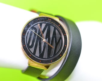 DKNY gold tone with black dial, wrap around bracelet  womens, wrist watch