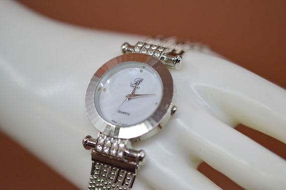 Silver tone with crystals, mop dial, womens watch - image 1