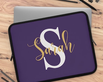 May include: Purple laptop sleeve with a white letter "S" and the name "Sarah" written in gold cursive lettering.