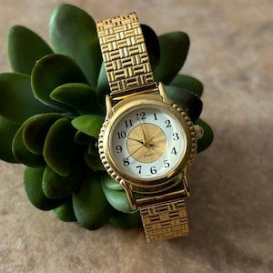 Avon Gold Tone Women’s Wrist Watch with Stretch Band